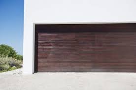 A sectional garage door opens vertically like a standard door, but without kicking out like an up and over door. Choosing The Best Garage Door Material