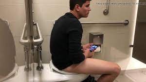 Jerking in public toilet