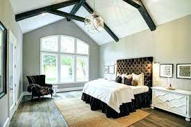 Master bedroom lighting ideas for a vaulted ceiling include adding a dramatic statement piece, like this stunning moooi heracleum pendant light. Home Architec Ideas Vaulted Ceiling Bedroom Decorating Ideas