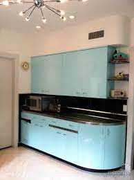 This article will explain how the costs of painting cabinets are generated and help you decide between making this if you're having your kitchen cabinets painted, it's likely that they'll recommend you use a fire retardant paint. Robert And Caroline S Mid Century Home With Dreamy St Charles Kitchen Cabinets Retro Kitchen Metal Kitchen Cabinets Retro Renovation