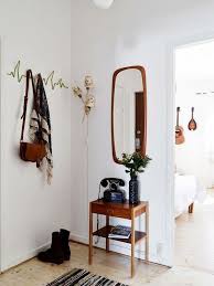 To achieve this, install a piece of furniture such as a narrow console table, or a beautiful. Eclectic Hallway Modest Eclectic Hallway Retro Home Decor Retro Home Entry Decor