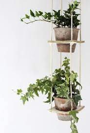This wrought iron 3 tier planter would sure dress up a front porch or patio. 24 Cool Diy Hanging Planters For Indoors And Outdoors Shower Plants Hanging Plants Hanging Planters