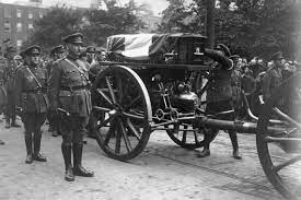 L/s of pallbearers walking down steps with coffin of general michael collins. One Fifth Of Ireland Attended Michael Collins Funeral