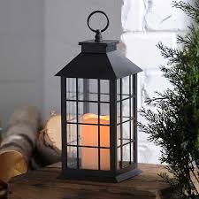 Position one or two towers on one side with a complementary sculpture on the other end. Black Lantern With Led Candle Kirklands