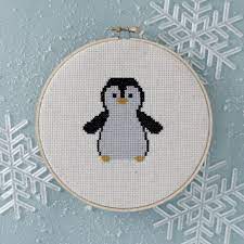 Model stitched on 28 ct. Cross Stitch Of The Month January Cross Stitch Patterns Cross Stitch Fabric Cross Stitch Animals