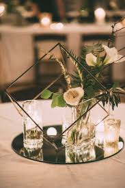 Shop modern centerpieces at 1stdibs, the world's largest source of modern and other authentic period furniture. Black Geometric Shape With White And Green Flowers And Crystal Votive Cups Weddin Modern Wedding Centerpieces Wedding Floral Centerpieces Wedding Centerpieces