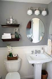A very smart idea is to lift the space at the end of the bathtub a bit and use it as a very good shelf. Small Half Bathroom Decor Ideas Novocom Top