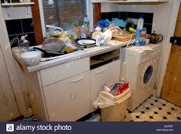 filthy kitchen sink with dirty dishes