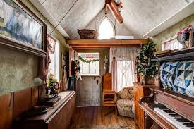 But that's not the thing that makes you remember it for the entire week, it is the bright colors. Victorian Style Tiny House With Piano That Turns Into A Bed