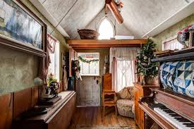 An electric water heater, a ductless cooling and heating system, a raised bar area for you to eat or work at, and more. Victorian Style Tiny House With Piano That Turns Into A Bed