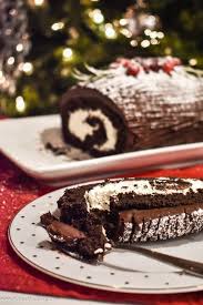 Yule Log Cake Buche De Noel Chocolate Cake Is Filled With Whipped Cream Rolled Into The Shape Of A Log And Coated W Yule Log Cake Log Cake Yule Log Recipe