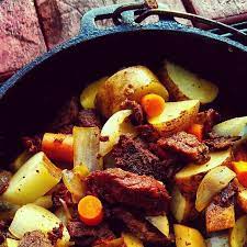 Traditional Camp Food Dutchoven Steak And Potatoes Food Recipes Dutch Oven Potatoes Dutch Oven Cooking
