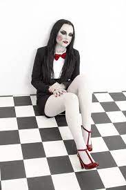 It features a striped dress with pom pom accents and a lace neck piece. Pin On Halloween