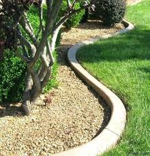 There are many types of edging stones for varying uses around the garden, some just sit in soil. Curved Concrete Garden Bed Edging Is A Chic Minimalist Idea That Will Match Any Plants Concrete Landscape Edging Concrete Garden Edging Landscape Edging