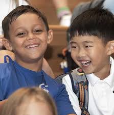 1. Ethan Zhou (left) grins in disbelief as he realizes his opponent Lev  Edelman has placed him in checkmate while Jason Smith looks on. The  Bromfield seniors attended the Pavilion Party held