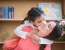 A parent and child doing a sensory activity together at home