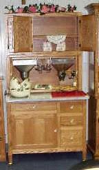 This beautiful hoosier cabinet is a reproduction of an original that was popular in the early 1900's. Amish Peddler Custom Handcrafted Amish Furniture