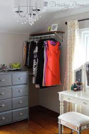9 Ways To Store Clothes Without A Closet Small Space Bedroom Small Bedroom Diy Small Bedroom Organization