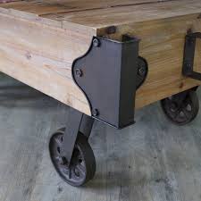 The presley coffee table has a rustic look with a driftwood grey finish and black metal hardware. Large Industrial Railway Cart Style Coffee Table