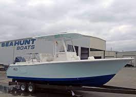 23 Foot Sea Hunt Center Console With Ice Blue Sides And Ice Blue Under The T Top Boat Building Bay Boats Fishing Boats