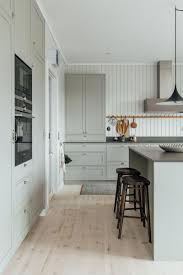 Granite/quartz countertops for pickled cabinets? The Newly Renovated Summer House Of Minna Jones In Finland Nordic Design Shaker Style Kitchens Country Style Kitchen Home