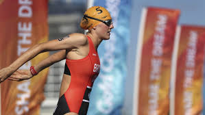 Back of female triathlete joanna brown (can) and competitors running with cycle in the transition zone in the women's itu world triathlon series event. Joanna Brown Wins Canada S First Medal Of The Commonwealth Games Ctv News