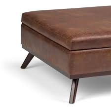 You can even use a small rectangular leather ottoman in the bedroom as a convenient spot to remove shoes and stash extra bed linens. Simpli Home Owen Distressed Saddle Brown Square Coffee Table Ottoman With Storage Axcot267l Dsb Rona