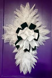 Beautiful white full cross with green velvet and white sparkle bow.  Pictures don't do this justice.