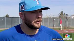 Texas Rangers first baseman Jack Burger explains his jersey number