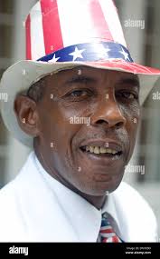 Portrait of a street performer dressed in a hat and tie with stars and  stripes, in the French Quarter of New Orleans, Louisiana Stock Photo