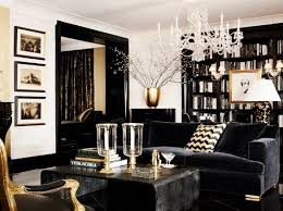 Black walls contrast starkly with a crisp white ceiling and white bedding. Metallic Gold Living Room Decor
