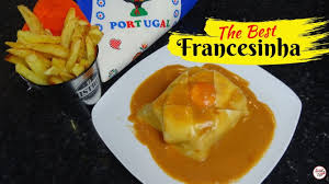 Francesinha (portuguese sandwich made with bread, ham, fresh sausage and covered with melted cheese and. Sanduiche Do Porto Francesinha Youtube