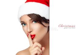 Donna Di Natale in Santa Hat Che Fa Un Segno Di Silenzio Immagine Stock