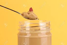 Delicious Peanut Butter In Jar And Spoon On Yellow Background Stock Photo Picture And Royalty Free Image Image 16726026