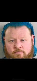 Woman near grand river ridge with a small dog. Beating