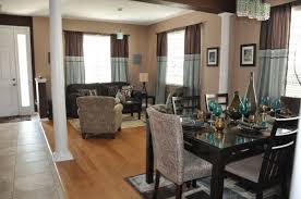 The property brothers gave this homeowner the formal living room of her dreams by framing the fireplace and adding elegant accessories, including brass sconces, splashy artwork and pillar candles. Turquoise And Brown Brown Living Room Brown Living Room Decor Turquoise And Brown Living Room