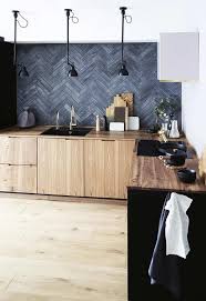 This photo further showcases the contemporary backsplash with the kitchen's overall black and white appearance. A Modern Kitchen Renovation In A Small Danish Terrace Modern Kitchen Renovation Interior Design Kitchen Kitchen Interior