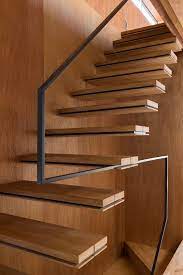 Minimalist Staircase With A Metal Handrail And No Balustrade Stairs Design Staircase Design Cantilever Stairs