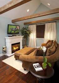 An Electric Fireplace Warmed Up The Master Seating Nook The Television Was A Must And Installed On A Pivot Arm Allowing O Bedroom Redesign Home Master Bedroom