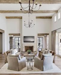 Gorgeous Rustic Ceiling Beams Hold Iron Chandeliers Over A Beautifully Appointed Farm House Living Room Farmhouse Decor Living Room Farmhouse Style Living Room