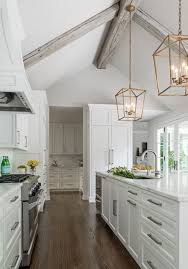 Often reserved for living rooms or great rooms, this architectural feature can also create a big impact in the kitchen. Cathedral Ceiling Adjacent To Room With 9 Ft Ceiling White Kitchen Design Home Decor Kitchen Vaulted Ceiling Kitchen