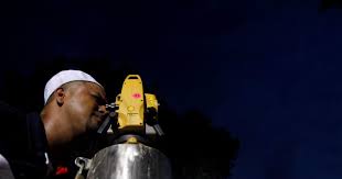 An man performs rukyah, the sighting of the new moon, which signals the start of the holy month of ramadan, in putrajaya, malaysia, may 26, 2017. Muslims In Malaysia Begin Fasting For Ramadan Tomorrow