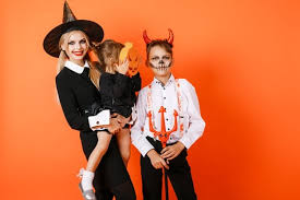 We have thousands of brother and sister costume ideas for people to go with. Premium Photo Older Brother And Sister Holding Little Sister In Halloween Costumes Posing Against Orange Wall Background High Quality Photo