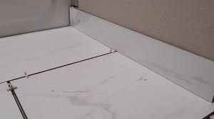 If you are installing tile with the existing baseboard, try finding the gap distance before selecting tile. How To Install A Tile Bullnose Baseboard Simple Easy Youtube