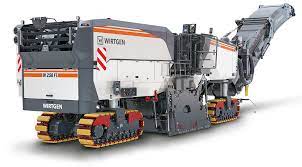 A wirtgen w 150 cfi cold milling machine milling asphalt from a exit ramp on the highway and the road down and loading the. W 250 Fi Cold Milling Machines Wirtgen