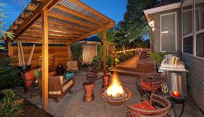 A fire pit with a wide burning area like this one needs to be used in a clear, open space. 6 Ways To Continue Socializing Outdoors As Weather Cools