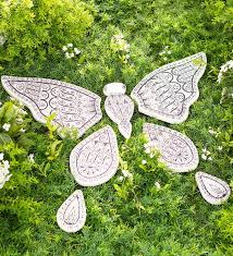 The Seven Cast Stone Pieces Of This Garden Stone Arrange To Form A Lovely Butterfly The Body Is One Piece And Butterfly Garden Garden Stones Stone Landscaping