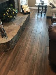 These wood grain tiles may look flat but they rarely are. Summer Work Updates Wood Look Tile Outdoor Kitchen Stonework