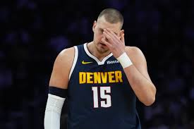 Nikola Jokic leaves Nuggets' game in Miami with injury - Denver Gazette