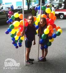 These Linking Balloon Rainbow Spray Backpacks Are A Huge Hit For Any Parade But They Go Over Sooooo Well With Pride E Balloons Rainbow Balloons Parade Float